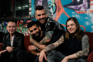 A War Within band sitting down for press shot