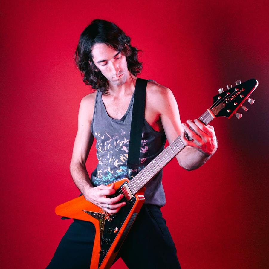 Image of Delicate Steve playing an electric guitar.